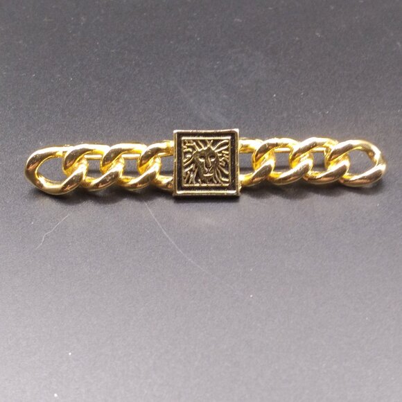 Gold tone Anne Klein Lion Bar Brooch - Picture 1 of 4